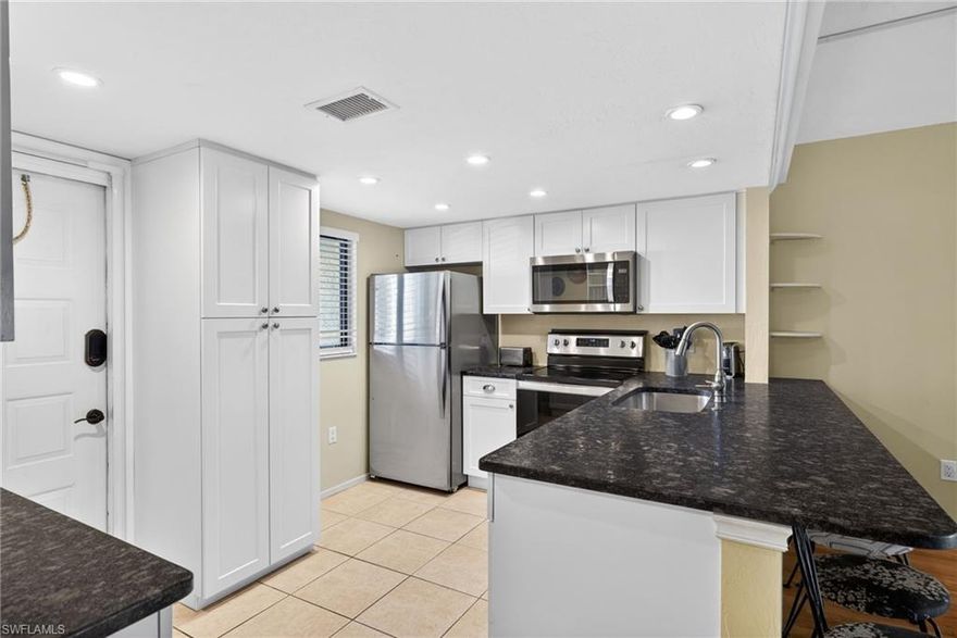 Discover the perfect blend of comfort, convenience, and effortless Florida living in this charming 2-bedroom 2-bath condo located in the convenient, gated community of Country Pines. Whether you’re searching for a full-time residence, seasonal retreat, or investment opportunity, this beautifully maintained home checks every box.
Step inside to a bright, open living area filled with natural light, creating a warm and inviting atmosphere ideal for relaxing after a day at the beach or gathering with friends. The thoughtfully designed layout flows seamlessly, and the kitchen offers ample cabinetry,  whirlpool appliances, and a generous workspace for cooking, hosting, or simply enjoying your morning coffee. Every detail is designed with easy, low-maintenance living in mind.
The bedrooms provide peaceful retreats with comfortable space and storage, while the bathrooms are bright and practical. The lanai features sliding Florida glass panels, to enjoy sunrise mornings, or evenings soaking in the year-round Florida sunshine. Residents of Country Pines appreciate the low HOA fees and exceptional amenities, including two heated community pools, outdoor propane and charcoal grills, and over 5 acres of maintained land with lush landscaping and swaying palm trees. The community features a gated entrance and full perimeter fencing for added privacy and peace of mind. Importantly, this property experienced no water damage from Hurricane Ian, and no costly Structural Integrity Report (SIR) is required, avoiding the expensive mandates impacting many Florida condominiums over three stories.
SWFL Easy living is calling—schedule your private showing today!