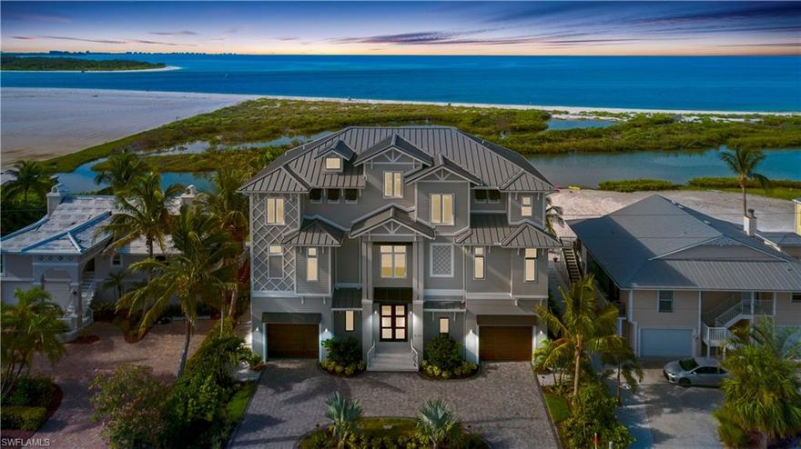 NEWLY-CONSTRUCTED beachfront masterpiece boasting panoramic Gulf & Beach views. Be the first to live in this designer furnished, coastal contemporary estate with a cool beachy color palette, soaring ceilings with wood-beam ceiling accents, all hardwood/tile floors (no carpet) & chef’s kitchen with white cabinetry, professional appliances plus walk-in wet bar. Fantastic open floor plan with dual master suites, double laundry & huge garage for 6+ cars. Lounge on your beachfront entertainment deck with outdoor kitchen, fireplace & infinity edge pool & spa, graced by Southern exposure for year-round sunsets & optimal sun on the pool. State-of-the-art features: Automatically-opening & fully-pocketing sliders for seamless indoor/outdoor beachfront living, hurricane impact glass, electric shutters, Lutron lighting system, private elevator & more. Sits on a rare stretch of beach with ultra private backyard & no passersby to be seen. Perfectly-located on the peaceful South end of Fort Myers Beach with easy access to Lovers Key/Bonita Beach & steps to fine dining.