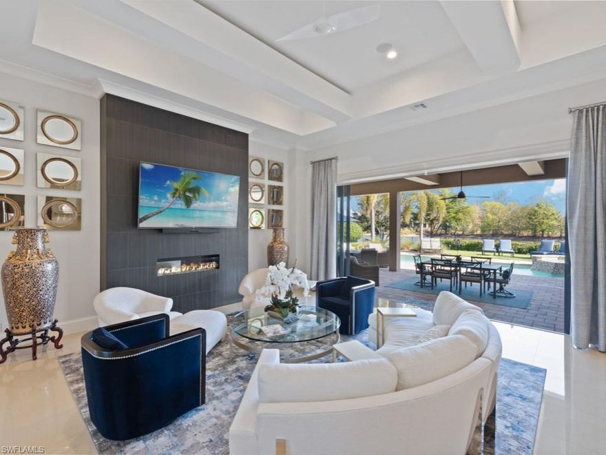 TRANSFERABLE GOLF MEMBERSHIP INCLUDED -  Price Reduced - Sophisticated elegance describe this stunning 4 bedroom, 4 bath, den/office, pool bath/powder room home in Quail West! Private lake view, no golf cart path, situated on 16th and 17th holes on the Lakes Course.  Chef's kitchen boasts zebra wood cabinetry, Sub Zero refrigerator, Wolf 6 burner gas cooktop, Miele coffee system, and huge walk-in-pantry. Climate controlled wine wall, built-in bar sink, ice maker, Thermidor refrigerator/freezer drawers.  Outdoor expansive lanai area with 2 fireplaces, outdoor kitchen and peaceful grassy yard.  Features new 2022 pool/spa heater, 7 TV's, LED lighting, Sonos system, hi-def speakers, whole house generator and water filtration system, 3 car garage with 2nd refrigerator/freezer/ice maker, 2021 A/C, storage, Smart electric hurricane screens, impact windows and other shutters complete this stunning home! Quail West 70,000+ sq. ft Award Winning Club House with two-18 championship golf courses, fitness, indoor pool, lap pool, sauna, steam, full-service spa salon, tennis, pickleball, bocce,  Multiple restaurants, Marketplace for Pizza, Breakfast & Even Flowers!! Exclusion List To Be Provided.