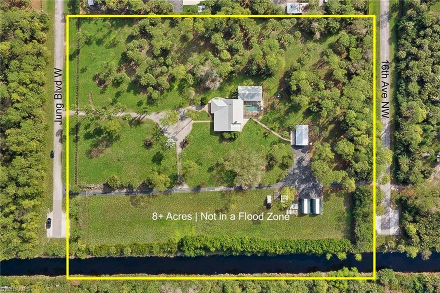 8.17 Acres! Exceptional Opportunity in Naples - Golden Gate Estates! This rare property offers more than just a beautiful home. Fully fenced and gated with three separate access points, the layout is ideal for those seeking space, privacy, and functionality, including the possibility of running a home-based business. Gated entry from two streets, a unique and valuable feature. The main residence features 4 bedrooms + a den, 3 bathrooms, and over 3,000 sq. ft. of living space, enhanced with Jerusalem stone floors, plantation shutters, solid wood interior doors, and a fully upgraded kitchen with gas appliances, electric oven, and a steam oven. Enjoy peace of mind with hurricane impact-rated doors, whole-home reverse osmosis system, emergency backup generator, and a fully upgraded electrical system. Outdoors, relax by the saltwater pool with gas heater, stay fit in the detached air-conditioned gym garage, and take advantage of the dedicated camper hookup. A canal-fed sprinkler system keeps the lush grounds green year-round or your own nursery! Not in a flood zone and located just minutes from Immokalee Rd. This is a rare find in Naples — perfect for someone seeking a private estate with room to grow and operate. Book a showing today!