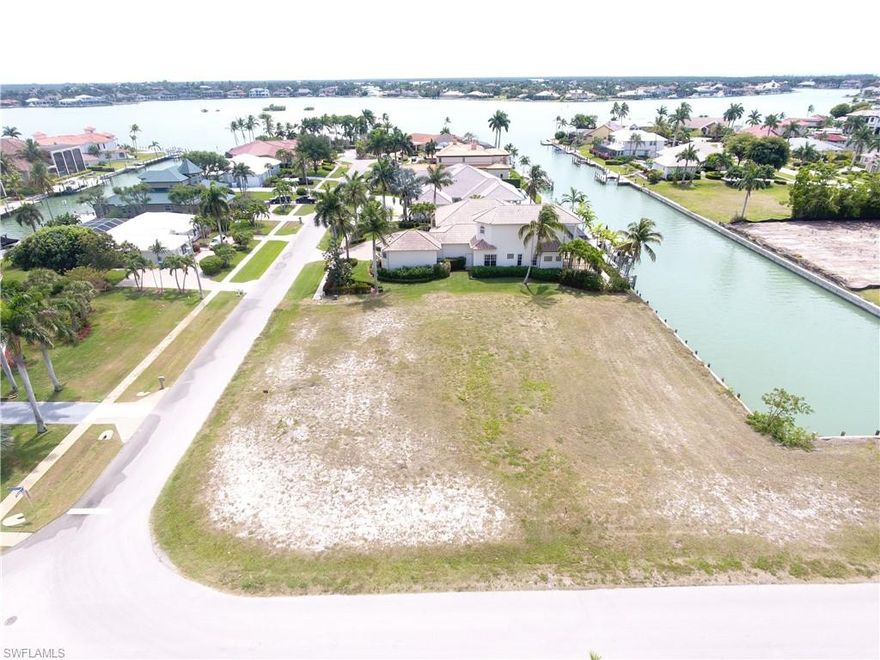 Corner LOT, with 160 ft. of canal frontage right off Robert's Bay.  SW exposure, build your dream home with private marina.  Great area with quick trip to beach and restaurants on south end of the island.