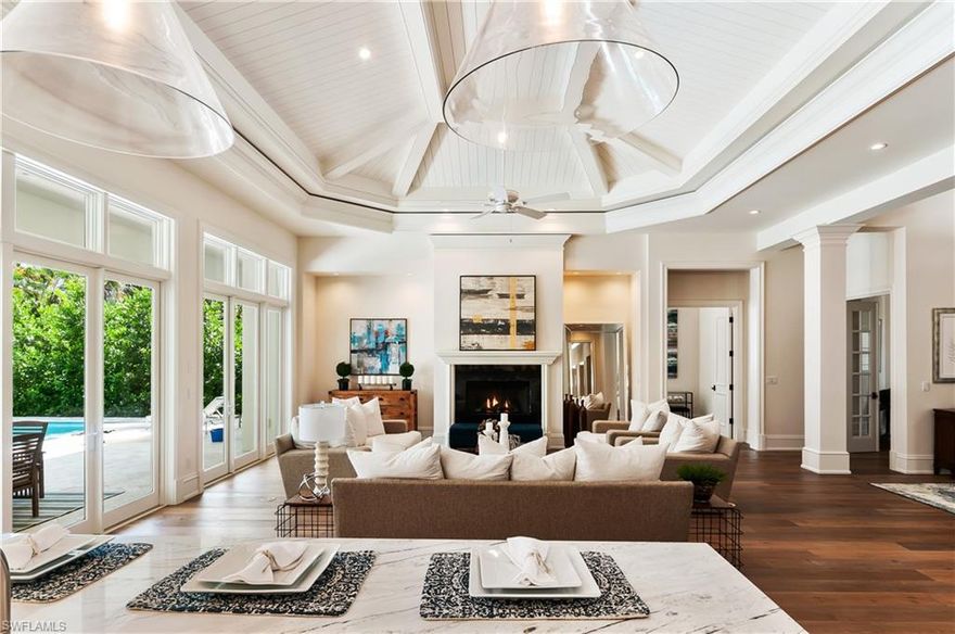 This beautiful one story home has a master suite and three guest suites plus a nice office. You will enjoy the outdoor living with over-sized pool deck, blue lagoon heated pool, spa, summer kitchen and outdoor fireplace. This contemporary home includes roll down shutters and screens, indoor fireplace, formal dining, is available fully furnished, has been professionally decorated with taste. The kitchen is fully equipped and include top-of-the-line appliances (Wolf/Sub Zero),stunning White Oak, a nice wine cooler. 3 car garages. Private beach in the Moorings.