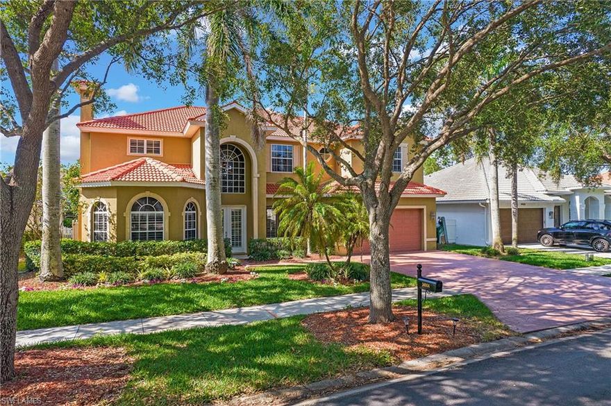 Exquisite 6 bedroom 5 bath home in the highly-sought after community of Indigo Lakes! Quality craftsmanship and pride of ownership is evident here. With luxury tile flooring throughout, custom woodwork in the family room, a custom stone fireplace in the front living area, 2 new HVAC units and thoughtful details, such as crown molding, tray ceilings and plantation shutters on the first floor. The newly painted interior and ceilings are light and bright neutral tones, lending a clean, modern feel that complements any decor. Step into the kitchen in the heart of the home, updated in 2022 with white cabinetry, tile backsplash, new hardware and dark granite counters. The second floor includes a spacious loft providing endless possibilities for a game room or a great place to entertain. The expansive primary suite is conveniently located on the main floor. Enjoy true indoor-outdoor living on the expansive screened lanai with a large pool, accessible from several areas in the home. The fully fenced yard is spacious and features a stone patio. New sod was installed in 2022 and new landscaping front and back. Indigo Lakes is in an A-rated school district (NOT rezoned), and provides easy access to I-75, dining, shopping, entertainment and more. Just a short drive to Naples beaches!