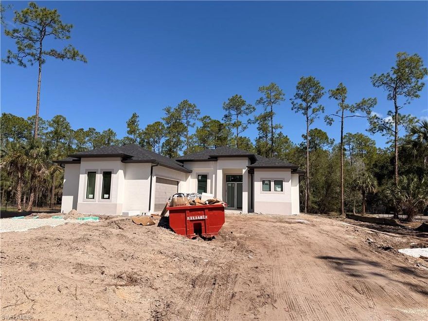 !!! GREAT LOCATION !! NEW CONSTRUCTION!!! BEAUTIFUL 3 BEDROOMS PLUS A DEN, 3 BATH AND 2 CAR GARAGE SITS ON 2.27 ACRES LOT.... THIS BRAND NEW HOME ALSO FEATURES A BRIGHT & OPEN FORMAL LIVING & DINING ROOM, IMPACT WINDOW, GRANITE COUNTER TOPS, STAINLESS STEEL APPLIANCES, TILE FLOOR WITH SPLIT BEDROOM, WALK-IN CLOSET IN MASTER BEDROOM, AUTOMATIC IRRIGATION SYSTEM, ASPHALT DRIVEWAY, AND MORE... BRING YOUR FAMILY AND YOUR PETS AND MAKE THIS HOME AN AWESOME PLACE TO LIVE **VERY PRIVATE AND CONVENIENTLY LOCATION NEAR SHOOLS AND PUBLIX SHOPPING CENTERS. '' WASHER,DRYER AND MAIL BOX ARE NOT INCLUDE''.