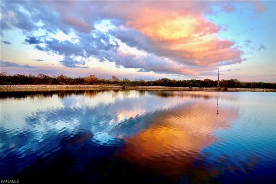 ON TOP OF IT ALL – HIGHEST FLOOR 3/2 CONDO AVAILABLE!
Rise high above the horizon w/panoramic views sweeping from the N end of FMB to the E end of Sanibel. The sun glistens on a 25-acre lake, the Bay & Gulf creating mesmerizing vistas. Acres of preservation land offer privacy & protection from future development. This home in the sky has been renovated in all the right places. The KIT is centralized & open to the Great RM allowing meal prep to take place while interacting w/guests. It has been renovated & updated w/SS appliances, gorgeous granite counters that run up the wall as a backsplash under white cabinets. A generous BRKFST bar expands seating options allowing for more guests. A walk-in pantry provides even more crucial storage. The Great RM has floor to ceiling, wall-to-wall hurricane impact glass sliders leading to an approx. 290’ screened lanai w/Storm Smart hurricane shades. This area is ideal for taking advantage of the views while living & entertaining outdoors.  The Primary BR has access to the lanai, a large window framing the water views, 2 WICs w/organizers & in-suite BA featuring white cabinets w/granite counters, 2 separate sinks, LG WIS w/pebble floor & frameless door, private water closet & soaking tub for relaxing after a stressful day. The split floor plan places the Guest BRs & Guest BA on the opposite side of the condo. Both BRs have plantation shutters & luxury vinyl floors. One BR dual serves as an office. The Guest BA is also updated w/white cabinetry, granite counter & WIS w/frameless door.
The LG laundry, located on the guest side of the condo, has been updated as well w/white cabinets, granite counter, deep soaking sink. The HVAC was replaced in 2020. A private 2-car garage under the BLDG & separate dehumidified storage area convey. Mastique is a 50-acre community w/lush tropical landscape & a 25-acre crystal clear lake. Living at Mastique isn’t just about owning a condo w/a stunning view, it is about a lifestyle featuring a 6000+ sq ft completely renovated clubhouse w/state-of-the-art fitness center, yoga studio, billiard/poker rm, a gathering space, dining rm, kitchen, media/meeting rm. Two outdoor spaces, one screened, allow for al fresco entertaining. A salt-water, 0-enty, resort style pool & spa are perched on the lake’s north edge. Mastique Lake, approx. 35’ deep, is catch & release. A mile long shell path surrounds the perimeter of the lake allowing for walking, jogging while taking in the peaceful, tranquil setting between the lake & preservation land. Canoes, kayaks & a paddle boat are available to skim across the pristine water. Ospreys are invited to make their home high on top of 2 poles w/special platforms for building nests. With binoculars from your lanai, you can watch the hatchlings grow & take flight. All of this nature & privacy make you feel far away yet you are just a short walk away from the beach, restaurants, grocery, shops & bike ride to FMB & Sanibel.