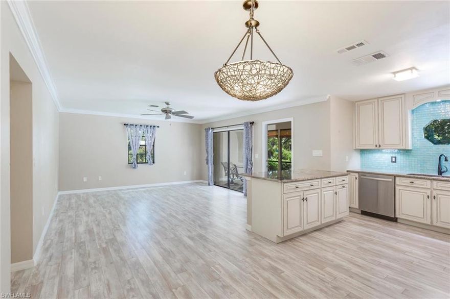 LOCATION LOCATION! This light and bright 2 bedroom 2 bath first floor residence in Sandpiper West residence has just been completely updated! With all new kitchen, bathrooms, flooring and more this is a must see! Comprised of almost 1200 sq. ft. of living area and an oversize lanai.  Corner unit has extra windows which brings in an abundance of natural light.  You can dock your boat on site at the common boat dock and head out to the Gulf with no bridges from this direct access canal location!  This charming complex has just 6 residences.  Imagine sitting on your screened lanai or lounging by the community pool overlooking the water! Just minutes from downtown Naples famous Fifth Avenue shops, fine dining, beach and Naples pier!