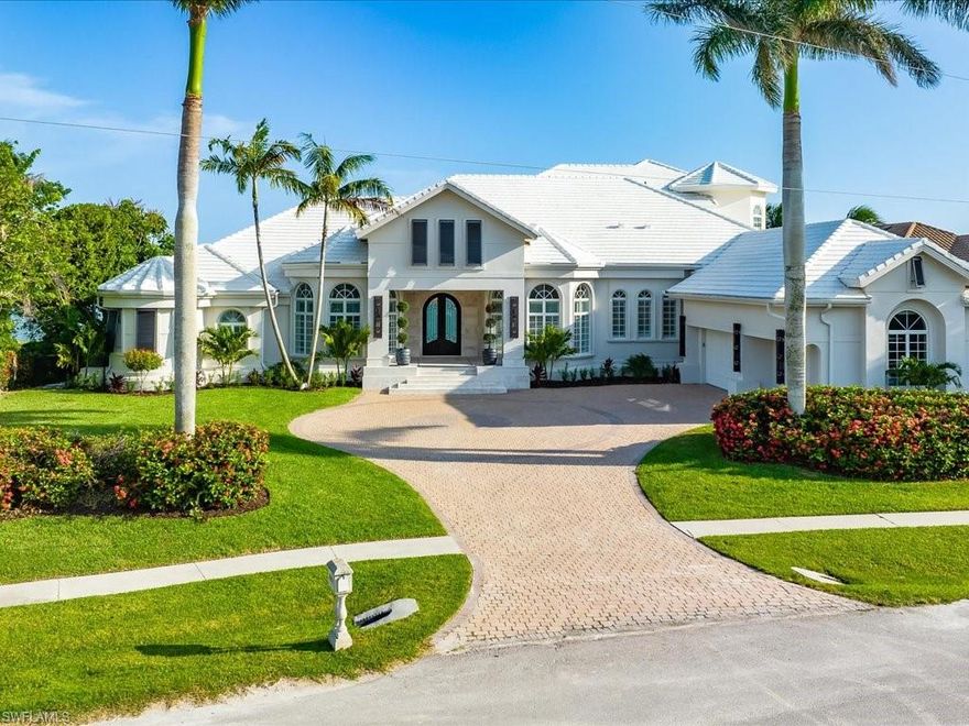 Experience idyllic waterfront living in this extraordinary Marco Island home, impeccably and entirely remodeled to offer the luxurious lifestyle you crave. A series of high-end finishes have shaped the gorgeous interior, including exotic woods, gleaming marble, and custom millwork and paneling that lend an atmosphere of refined elegance. Bespoke built-ins, plantation-shuttered windows, and stylized ceilings with stunning lighting are just a few of the exquisite details that will capture your attention. Admire the magnificent views as you work your culinary magic in the chef’s kitchen, fitted with Viking stainless appliances, abundant white cabinetry, and sleek quartz countertops. Southern exposure and an impressive 106 ft of water frontage ensure unobstructed panoramas of Caxambas Bay as you relax on the large screened-in lanai or take a refreshing dip in the pool and spa. With a newly constructed dock, boating and fishing enthusiasts will be just a short ride from the gulf. For your convenience, this remarkable residence has integrated Control4 home automation. A fabulous location means shopping, dining, parks, and beaches are nearby. Come take a tour before it’s gone for good.