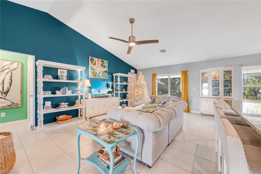 Discover modern Florida living in this stunning 3 bedroom 2 bath home with a versatile den. Built in 2023, this like new residence combines contemporary design with the ultimate Southwest Florida lifestyle. Step inside to an inviting open concept floor plan bathed in natural light, where soaring ceilings create an impressive sense of space and airiness. The thouhghtful layout seamlessly connects the living areas, making it ideal for both everyday living and entertaining guests. The space features gorgeous tiled floors, clean white cabinetry, and stunning granite countertops that blend beautifully together. Embrace year round living on your screened lanai, the perfect retreat for morning coffee or just relaxing while enjoying Florida's beautiful weather. The nicely sized yard provides plenty of room for play, gardening, pets, or adding your own personal touches like a pool. Also an added plus is epoxy flooring in the two car garage, a whole home water softner, and a lawn irrigation system. With peace of mind that comes with recent construction and modern efficiency, this home is move-in ready and waiting for you to start making memories. Experience the best of Cape Coral living - schedule your showing today!