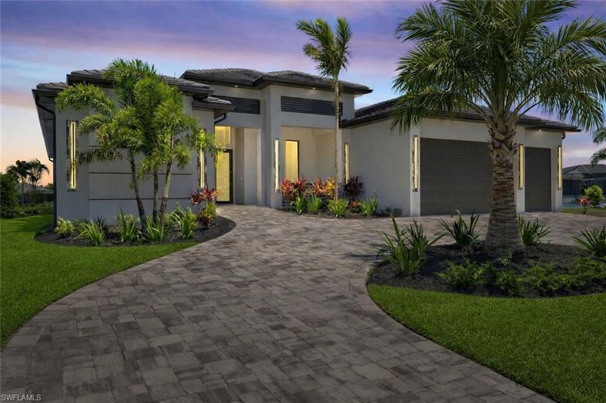 Experience the ultimate blend of luxury, comfort, and modern coastal design in this newly completed 3-bedroom + den, 3-bathroom waterfront residence with a spacious 3-car garage. Offering 2,200 square feet of thoughtfully designed living space, this exceptional home is ideally located just off Surfside Blvd in one of Cape Coral’s desirable neighborhoods, with Gulf access on an impressive 350-foot-wide canal.

From the moment you step inside, soaring ceilings, refined finishes, and a bright open-concept layout create an atmosphere of elegance and sophistication. The gourmet kitchen is a true showpiece, featuring a quartz waterfall island with bar seating, premium appliances, sleek backsplash, and a custom coffee station—perfect for everyday living and effortless entertaining.

The living area is anchored by a striking custom media wall complete with an 85” TV and electric fireplace, complemented by dramatic 12-foot coffered ceilings that elevate the space while maintaining a warm, inviting feel.

The owner’s suite serves as a private retreat, offering direct lanai access, dual oversized walk-in closets, floating vanities, a freestanding soaking tub with designer accent backsplash, and a beautifully appointed walk-in shower—designed to rival a luxury spa experience.

Step outside to embrace true Florida waterfront living. The expansive covered lanai overlooks a heated pool and spa and features an outdoor grill station, dedicated seating area with mounted TV, and ample space for hosting guests, enjoying sunset views, or unwinding in your own private oasis year-round.

Equally impressive, the exterior showcases a semi-circular paver driveway, lush tropical landscaping, and a modern tile roof that blends durability with timeless architectural appeal. Fully completed and move-in ready for its very first owner.

If you’re seeking a luxury Gulf-access home that delivers on design, location, and lifestyle—without compromise—this property truly stands apart. Schedule your private showing today and experience Cape Coral waterfront living at its finest.