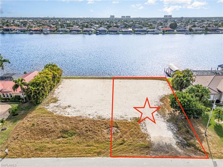 This lot has everything you have been searching for to build your new SW Florida dream home.  You’ll enjoy amazing SOUTHERN EXPOSURE VIEWS across Lake Finisterre, the largest GULF ACCESS lake in Cape Coral.  Being in the middle of the lake provides outstanding sunrise and sunset views.  The lot also provides fast gulf access under the tallest bridge in SW Cape Coral with a quick ride to Cape Harbour with four waterfront restaurants and Marina Village with six waterfront restaurants.  On top of OUTSTANDING VIEWS and GREAT GULF ACCESS the lot itself has a brand-new seawall with taller 10’ panels and it is oversized offering 6.5’ more in buildable depth than a typical lot.  The lot is also pre-filled saving thousands in construction costs.  This lot will fit most every builder’s model home and there is a great custom home plan available which was designed to take advantage of this extra lot depth.  This is a one-of-a-kind lot rarely available.  Take a look today.