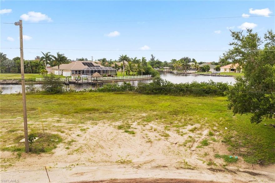 Lovely oversized waterfront corner lot ready for you to build your dream home. Just minutes to the Gulf of Mexico right from the canal in your backyard. Buyers are responsible for any outstanding assessments.