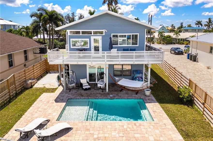 This beautifully remodeled 2-bedroom, 2.5-bath waterfront POOL home offers the perfect blend of upgrades and coastal living. Located just minutes from open water, it’s ideal for boating enthusiasts and anyone who loves the Florida lifestyle. The home features 1,200 sq. ft. upstairs and an additional 650 sq. ft. of air-conditioned living space downstairs with a convenient powder room. Every detail has been thoughtfully updated, including a new roof in 2023, new hurricane-rated windows and doors, and new plumbing and electric throughout. The interior remodel includes all new countertops, sinks, tile showers, a bath/shower combo, fixtures, and beautiful new flooring. The kitchen has been upgraded with a new gas range, refrigerator, and dishwasher (2024), creating a bright and functional space that’s perfect for entertaining or everyday living. Step outside and enjoy your new saltwater pool (2025), a new composite deck (2024), and a new dock with lift and seawall (2020). A 1,000 lb. outdoor mechanical lift, 30 amp plug, and pump/dump station for an RV make this property exceptionally versatile. There is also plenty of parking for boats, RVs, and cars, making it easy to enjoy the water and the outdoors. The home includes new AC with three mini splits (2023), new sod and fencing (2025), and new garage doors (2024). The downstairs features enclosed walls with Durarock on the bottom four feet for extra durability, and the exterior has pressure-treated shadow boxing custom rails. With a transferable flood policy ($2,000), this home offers peace of mind and ease of ownership. Furniture is negotiable, making this truly turnkey and move-in ready. Every upgrade has been completed so you can simply relax and enjoy your waterfront paradise.