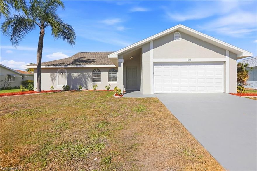 Located in a prime Southeast Cape Coral neighborhood, this well-maintained 3-bedroom, 2-bath home offers 1,522 square feet of comfortable living space with easy access to downtown Cape Coral, Fort Myers via nearby bridges, local parks, and area amenities. Fresh interior and exterior paint, updated landscaping, and new window coverings create an inviting first impression, while the light-filled living and dining area features tile flooring, vaulted ceilings, a ceiling fan, and sliding glass doors that open to the backyard. The separate kitchen offers granite countertops, rich cherry cabinetry, stainless steel appliances including a brand-new dishwasher, and a bay window nook ideal for casual meals or morning coffee. A desirable split-bedroom floor plan provides privacy, with the primary suite tucked away and offering patio access via slider, a walk-in closet, and a private bath with granite vanity and walk-in shower. Two guest bedrooms with luxury vinyl flooring share a hallway bath with granite vanity, tub/shower combination, and convenient access to the future pool area. An indoor laundry room near the primary suite leads to the two-car garage featuring a reinforced garage door and freshly painted floor. Outdoors, enjoy the expansive screened lanai that spans the entire back of the home, creating an ideal space for relaxing or entertaining. Located in an X flood zone and supported by a solid rental history, this home offers both comfortable living and strong investment potential.