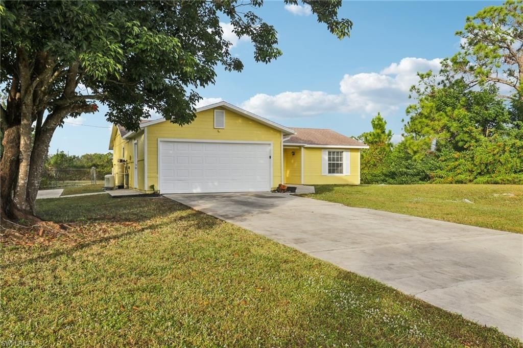 Photo of 519 Leroy AVE, LEHIGH ACRES, FL 33972 (MLS # 225083455)