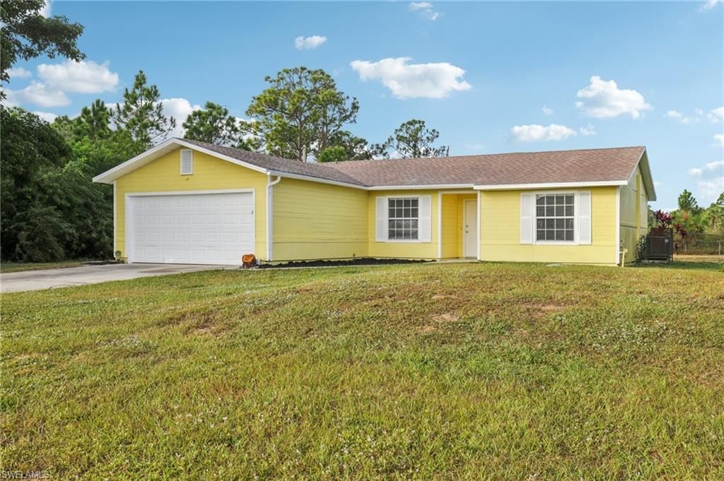Photo of 519 Leroy AVE, LEHIGH ACRES, FL 33972 (MLS # 225083455)