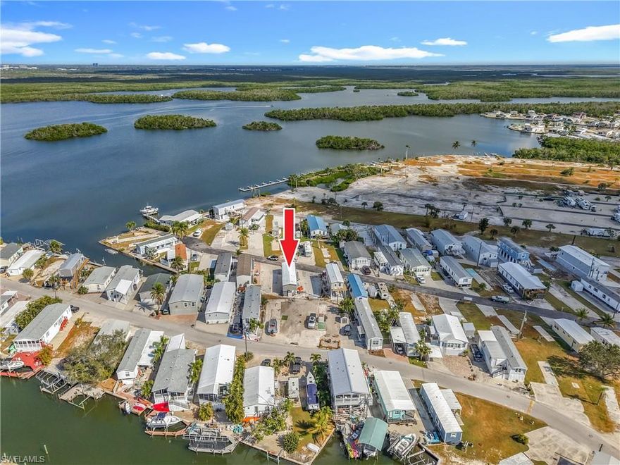 Welcome to Helen Lane on San Carlos Island, un-incorporated Fort Myers Beach. This elevated 2015 move-in-ready two-bedroom, two-bathroom single family home is being sold Turnkey for full-time or seasonal residence, as well as vacation rental options. You own the land and dogs are permitted with limits. This well-maintained, stylishly decorated home with central AC, has two entrances: one into the living area and a private one for the master bedroom. As you walk into this open concept home, you'll love the clean spacious kitchen, with plenty of storage & counter space, newer appliances and dining area. The natural light through-out the home creates a calm, tranquil setting. Open and comfortable living area with plenty of room for family and friends. The laundry area is conveniently located in the residence. Outside there is a storage shed and patio area to enjoy the warm Florida weather. Helen Lane is a 55+ street, with low fees of just $95 per month that includes water, sewer, streetlights and trash pick-up. Walk to the end of the street and enjoy the community Bayfront Terrace with gorgeous views. San Carlos Island has many great restaurants, bars, entertainment, fishing, boating and more.  A walk over the bridge takes you to even more restaurants, bars, resorts, entertainment and the white sandy beaches! You and your guests are going to love it here.