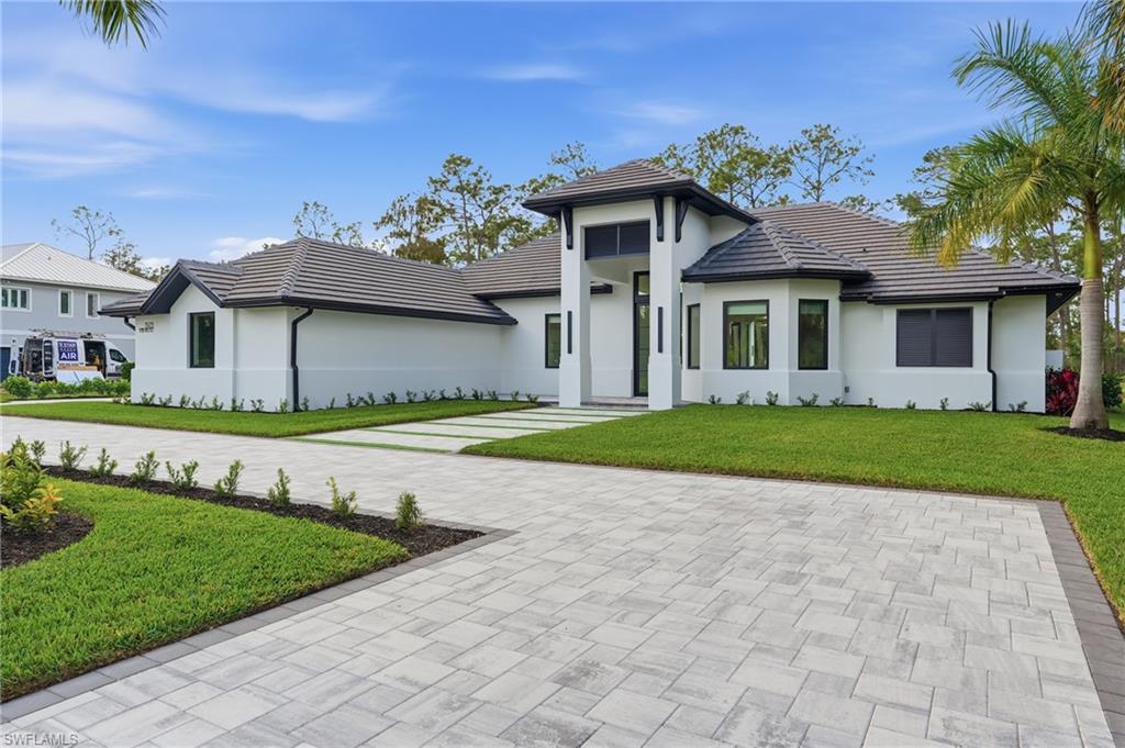 Photo of 13455 Pond Apple DR E, NAPLES, FL 34119 (MLS # 225084260)