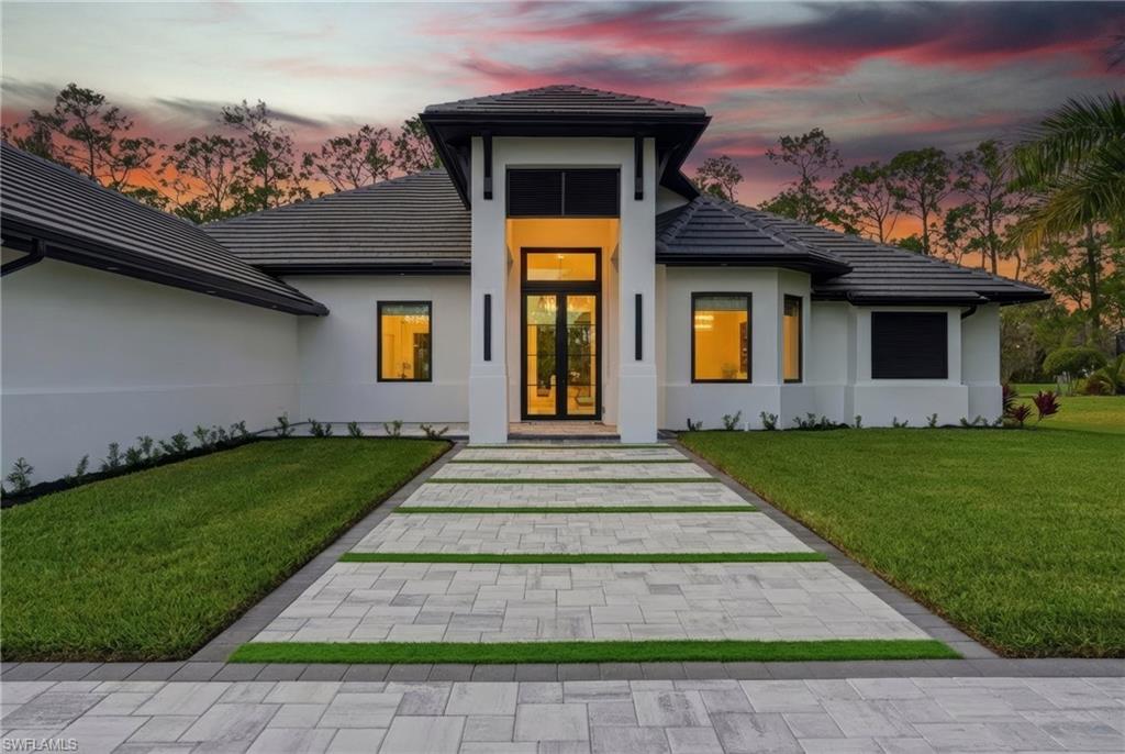 Photo of 13455 Pond Apple DR E, NAPLES, FL 34119 (MLS # 225084260)
