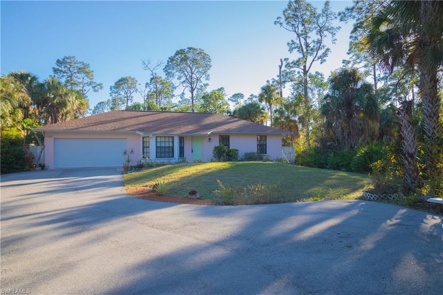 Located off 951 (Collier Blvd) and Pine Ridge, On same street as the Publix Plaza (Walk for groceries). Location - Location - Location! Original Owner has Lovingly cared for this property and its move in ready for it's new owner - freshly painted - kitchen upgraded - and landscaping completed. Beautiful Vaulted ceilings in the home, private dining room, oversized pantry, and tons of windows for natural light! Newer Ac, Newer Water Heater, New Dishwasher, New Microwave, Clean roof, Gated entrance, circular paved drive, rain gutters, and hurricane window coverings are all ready for you!
Screened back porch with tile for entertaining, overlooking the manicured 1.14 acre lot with forest and Fruit trees -  VIEW Video Tour - Live Boldly! Be You! Welcome Home!