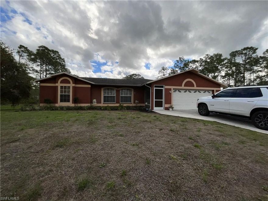 Very nice, 3 bedroom, 3 bath with two suites, two screen porches, screen pool, 2 car garage and 1 acre lot, close to State Road 80 but very private.