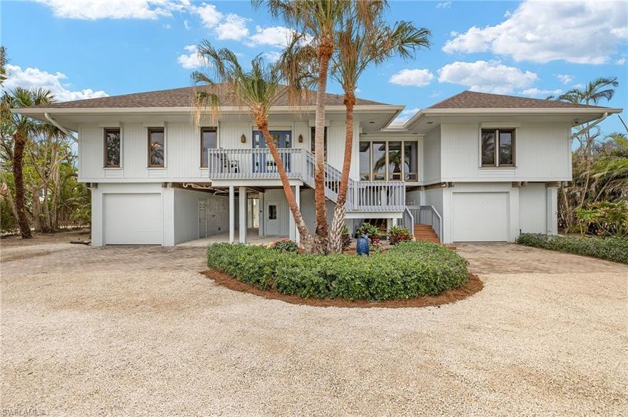 Experience coastal living at its finest at 5045 Joewood Dr., where luxury meets tranquility on a sprawling 3-acre lot with 100 feet of Gulf frontage. This meticulously maintained home boasts 3 bedrooms, 3 bathrooms, and a private home office, along with a chef-inspired kitchen featuring custom cabinetry, quartz countertops, stainless steel appliances, and built-in wine and beverage coolers. A newly installed roof, air conditioning, and electrical systems ensure worry-free living, while luxury vinyl plank floors and electric storm protection add to the home’s appeal. Step outside to the expansive 60-foot porch and take in the stunning Gulf views, all surrounded by newly landscaped grounds that offer both beauty and privacy. With an elevator for convenience and ample storage space, this exceptional property is the perfect blend of modern luxury and natural splendor.