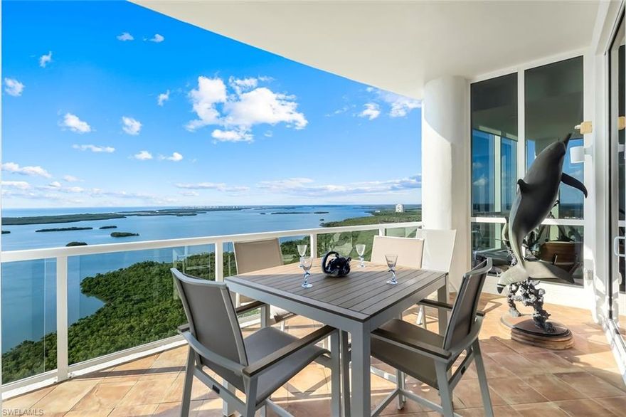 This truly remarkable 4-bed + den, 4.5-bath Seaglass Penthouse with a private 2.5-car garage offers a bird’s-eye perspective of paradise. With panoramic views of the Gulf of Mexico and Estero Bay, every room was designed around the drama of the horizon, where endless sky meets shimmering water. Elegant coffered and tray ceilings with cove lighting elevate the open layout, while floor-to-ceiling glass immerses you in natural light and sweeping coastal vistas. A cozy fireplace, wet bar, and two open-air balconies set the stage for effortless entertaining and tranquil evenings aloft. The chef’s kitchen impresses with a 48" Sub-Zero refrigerator, Thermador gas cooktop, Bosch wall oven, dual wine coolers, and rich light wood flooring throughout. Smart-home features include a Lutron shading system, audio/visual network, and whole-home automation. Within Seaglass, enjoy concierge services, a private theater room, guest suites, and a resort-style pool and spa. Beyond, the Bonita Bay lifestyle unfolds an on-site marina with restaurant and boat storage, miles of walking and biking trails, kayak rentals, and a staff-attended private beach club on Bonita Beach just minutes away. Private Membership at The Club at Bonita Bay opens access to five championship golf courses by Arthur Hills and Tom Fazio, 18 tennis courts, pickleball, croquet, five restaurants, and a state-of-the-art Lifestyle Center and spa. Where sky, sea, and luxury converge, this penthouse stands as a sanctuary in the clouds, crafted for those who see beauty not just in the view, but in every detail that frames it.