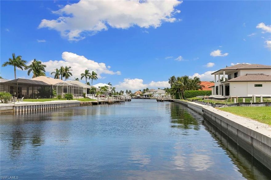 Beautifully updated Marco Island waterfront home offering quick direct access to the Marco River and the Gulf from your private dock with lift. This property provides exceptional peace of mind with no history of insurance claims by owners and full impact windows and doors throughout, a rare advantage for coastal buyers. This move-in-ready residence features four bedrooms and three full baths, including a spacious main suite and guest en suite, making it ideal for hosting guests or maximizing rental potential. A thoughtful split-bedroom floor plan provides privacy and comfort while bright living spaces create an inviting coastal atmosphere. The updated kitchen includes quartz countertops, a breakfast bar, newer appliances, and ample cabinet storage, opening into spacious living and dining areas ideal for entertaining. Recent improvements include a new roof (2019), new flooring (2023), remodeled pool and lanai with new heater and filter (2024), and new front doors, landscaping and exterior lighting (2026). Go outside to the large, screened lanai with an oversized pool and beautiful long canal views, creating a setting for relaxing or entertaining. Offered fully furnished with a strong rental history, this property presents an outstanding opportunity for investors and full-time residents seeking the Marco Island waterfront lifestyle.