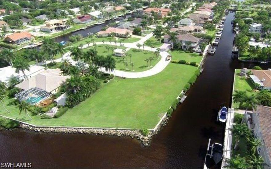 Incredible oversized river front estate 3/4 acre parcel located in beautiful upscale gated community. Fantastic awe inspiring water views. Huge wrap around frontage. Ideal setting, maximizing unobstructed views. Seawall, Rip Rap and new 200+ft dock w/ water and electric already in place. Lifts negotiable Completed plans for 7800sq/ft home. Minutes to gulf waters. Build your dream home here!