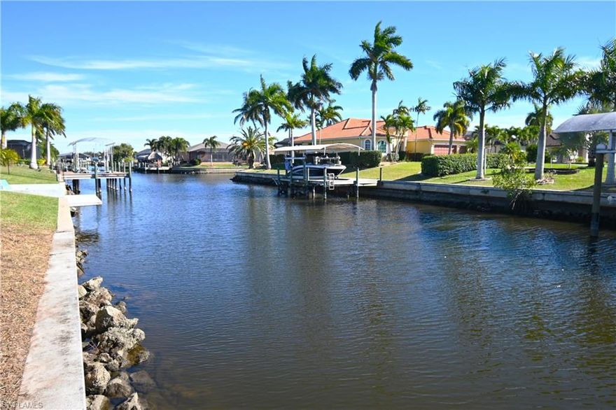 Beautiful south exposure gulf access lot with seawall on the 80 ft wide Bonnie canal ready for your new construction project. Canal system leads you to Lake Yuma and Lake Louise on the way out to the Gulf at the south tip of the Cape. Great neighborhood with bigger homes around. Quick access to Skyline or Pelican Blvd, close to Walmart neighborhood market and Pelican Soccer and Baseball Complex.