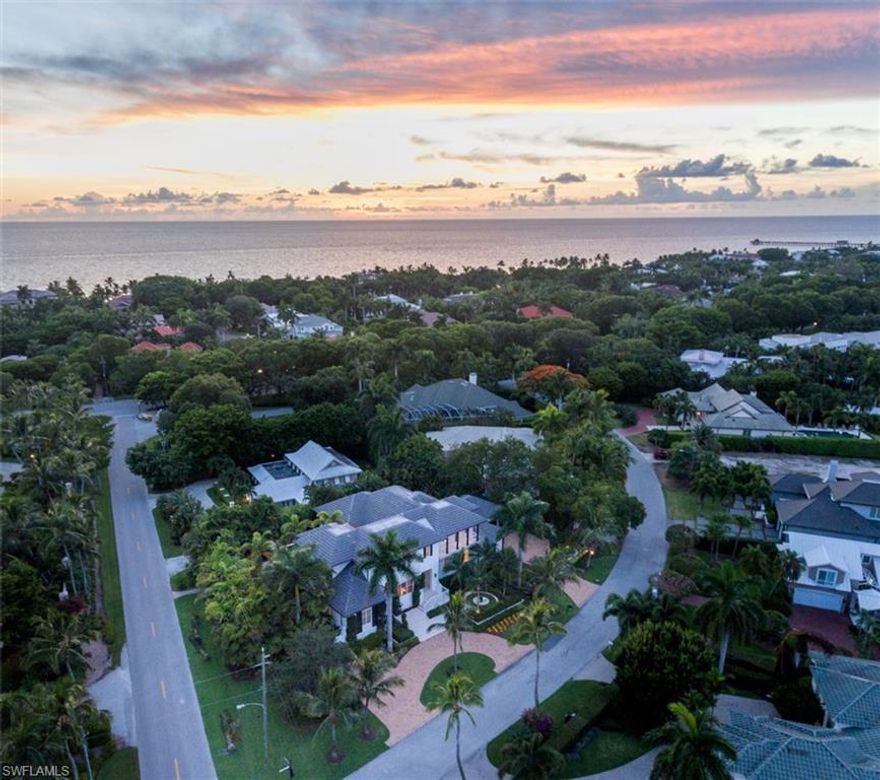 Luxurious home in Aqualane Shores to deliver the ultimate in Naples' lifestyle. Near 3rd St S shops and restaurants. Ideally situated mere steps to the beach. This oversized estate boasts coveted Southwest exposure for maximum sun with lush landscape and a phenomenal outdoor living area with expansive decking. The spectacular curb appeal is stylishly introduced by the two large brick driveways and is matched by the meticulously designed West Indies style home, penned by renowned architect Stoft-Cooney, with lavish interiors. The luxury kitchen includes Subzero, Wolf, and Miele appliances for the artisan or casual cook. Concrete block construction, a whole house generator, and motorized screens and shutters provide peace of mind for this private oasis.