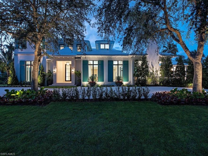 New construction - timeless British West Indies inspired home with premium Olde Naples location 3 blocks to the beach and close to 5th Ave S. shopping and dining. Inspired by PERE Development and penned by Kukk Architecture. This striking home includes 4 spacious en-suite bedrooms plus a study and powder bath. Your chef’s dream kitchen with custom cabinetry and large island features Miele appliances. French oak plank-flooring & detailed craftsmanship of this one-of-a-kind property spans throughout. Floor to ceiling windows fill the home with natural light. Glass sliders seamlessly open the great room to the covered outdoor living area perfectly equipped for entertaining with fireplace and summer kitchen. The exterior features include a large pool with shell stone and teak decking, an outdoor fire pit with a reflective pool and tropical landscaping. This home boasts unrivaled finishes, full concrete construction and a 3 car garage.