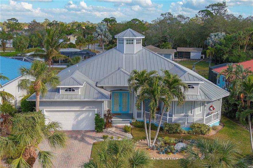 Discover this Key West–style Gulf access pool home located in the desirable gated community of Paradise Village on the Imperial River. This tropical boating community features elegant estate homes, lush landscaping, and an impressive gated entrance offering privacy and charm. This unique residence offers an open and spacious floor plan with soaring 20-foot ceilings, abundant natural light, and plantation shutters throughout. The great room features a dome providing extra sunlight, creating a bright and inviting atmosphere. The kitchen is designed for both style and functionality, featuring granite countertops, stainless steel appliances, ample cabinetry, and an open layout perfect for entertaining family and friends. The home’s French doors open to a large screened lanai and private pool area surrounded by tropical landscaping—ideal for relaxing, dining outdoors, or enjoying Florida’s beautiful sunsets. The primary suite offers two closets and a large en-suite bath with dual vanities, walk-in shower, soaking tub, and linen closet. The front bedroom is perfect for guests or use as a home office. The oversized third bedroom provides additional flexibility and can easily be divided into two rooms or converted into an office or media space. Enjoy Gulf access from your own private dock and boat lift located in your backyard—perfect for fishing, kayaking, or boating out through the river and Gulf. This side of the canal is wider and deeper offering more space and easier boating access. With its high elevation and solid construction, this home has never experienced flooding. Ideally located off Terry Street, this property offers convenient access to all that Bonita Springs has to offer. Just minutes to Downtown Bonita Springs, the Promenade at Bonita Bay, Sugarshack, local breweries, restaurants, shops, walking and biking trails, and only a short drive or boat ride to the beach. Easy access to I-75 and RSW International Airport adds to the convenience of this prime location. Experience the ultimate Florida lifestyle in this Gulf access pool home offering space, comfort, and coastal living in one of Bonita Springs’ most desirable boating communities. Note: This home has never flooded.