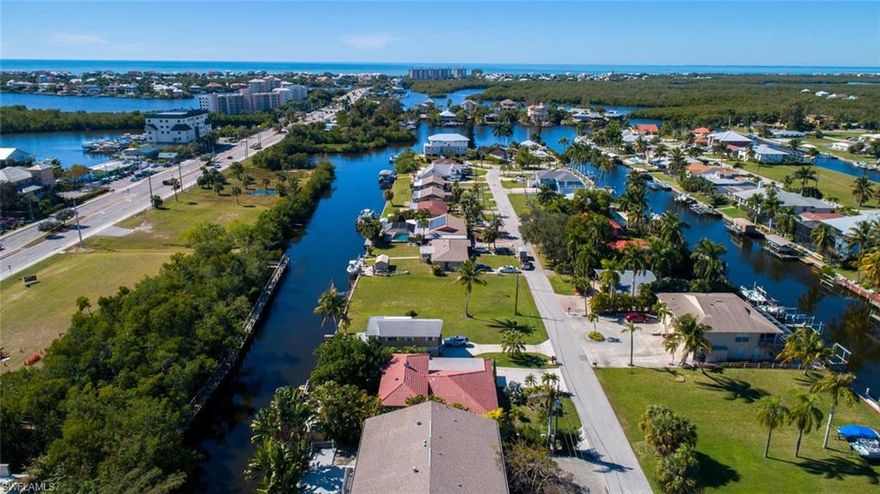 Prime canal lot with private southern rear exposure, concrete seawall, two docks having EZ Gulf Access by boat, and walking distance to Beautiful Bonita Beach. Build your dream home here and enjoy the Florida Lifestyle. Walking distance to fine and casual dining, and close to Promenade at Bonita Bay, Coconut Point Mall, Mercato, Whole Foods and RSW airport via Bonita Beach Rd. and I-75.  See attached plans for New Construction Opportunity on this vacant Gulf Access Lot.