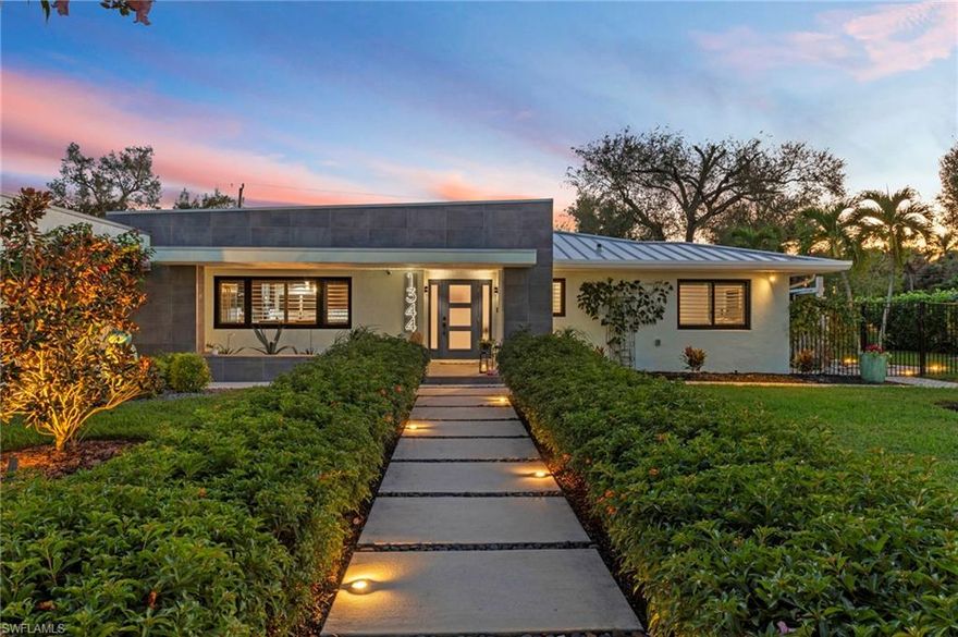 Experience refined Florida living at 1344 Coconut Drive, a beautifully updated home offering over 2,600 sf. of living space, set on a rare HALF-ACRE LOT with desirable southern rear exposure in the Palm Gardens neighborhood along Fort Myers’ iconic McGregor Corridor. This property offers the freedom of NO HOA and is located in Flood Zone X, providing peace of mind and flexibility rarely found in this area. Surrounded by mature palms and lush landscaping, the home blends modern upgrades with timeless Old-Florida character, just minutes from downtown Fort Myers, dining, shopping, and riverfront parks. Inside, a light-filled open-concept floor plan features a vaulted living-room ceiling, modern porcelain tile throughout, plantation shutters, and custom privacy shades. A versatile flex room with French doors and padded vinyl flooring is ideal for a home office, studio, or play room. The gourmet kitchen showcases a large center island, quartz countertops, farmhouse sink overlooking the lanai, custom soft-close cabinetry with designer hardware, and premium JennAir appliances. A custom interior bar with glass shelving and a wine/beer refrigerator enhances entertaining. Outdoor living includes a travertine paver deck surrounding a resort-style pool with sun shelf and bubblers, plus a new pool pump, heater, and chiller. Enjoy a fire pit, outdoor shower, custom outdoor bar, sail shades, and an electric shade off the primary suite. Mature fruit trees—lime, orange, Haas avocado, and Meyer lemon—add charm and privacy. Additional highlights include a flat-seam metal roof (2023), Anderson impact windows with transferable warranty, impact sliders, updated sprinkler system, epoxy garage flooring, and a dedicated pool bath. A private guest suite with luxury ensuite and direct side-yard access provides excellent accommodations for guests. Located in one of Fort Myers’ most desirable historic corridors, this property offers a rare combination of space, style, and location.