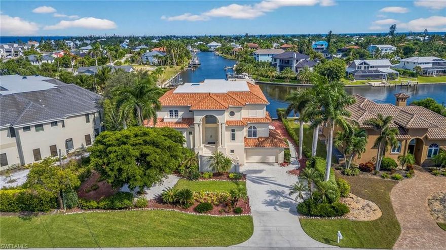 This exquisite canal front residence offers an exceptional combination of elegance, comfort, and island living at its finest. Nestled on the East End of Sanibel, this spacious three level home with a private elevator provides deep water access, a private dock with water and electric, and a boat lift for effortless days on the water.
Inside, the attention to detail is evident throughout. The main living level features stunning marble floors, a welcoming living room with a propane fireplace, and a formal dining room enhanced by a coffered ceiling and custom-built ins. The expansive family room opens through impact sliders to a screened lanai overlooking the pool and canal, blending indoor and outdoor living seamlessly. The gourmet kitchen is the heart of the home, showcasing a center island, breakfast bar, stand-alone refrigerator and freezer, gas range, and a butler’s pantry with a wall oven, ideal for entertaining or family gatherings. A guest bedroom with a private bath on this level ensures comfort and convenience for visitors.
The upper level is dedicated to privacy and relaxation. The spacious primary suite features two walk in closets and a spa inspired bathroom with dual vanities, a soaking tub, and a separate shower. Two additional bedrooms, each with their own balcony, provide tranquil retreats for family or guests. One balcony offers access to the home’s crow’s nest, a unique feature that provides panoramic views and the perfect spot to watch island sunsets or enjoy quiet moments overlooking the water.
The lower level offers exceptional flexibility with both finished and unfinished spaces that can be tailored for hobbies, fitness, or additional storage. A large garage provides ample room for vehicles, golf carts, or kayaks, with easy access to the lanai and pool area. The screened outdoor living space includes a heated pool and spa surrounded by lush tropical landscaping that enhances privacy and tranquility.
Designed for both relaxation and recreation, this home perfectly captures the Sanibel lifestyle. Enjoy peaceful mornings by the water, afternoons by the pool, and evenings watching dolphins play in the canal, all from your own backyard. Located just minutes from the Causeway, the island’s beaches, bike paths, and dining, this elegant retreat combines refined living with coastal ease.