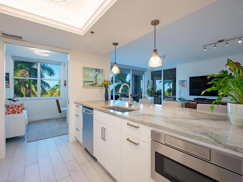 Photo of 6585 Nicholas BLVD #303, NAPLES, FL 34108 (MLS # 225076482)