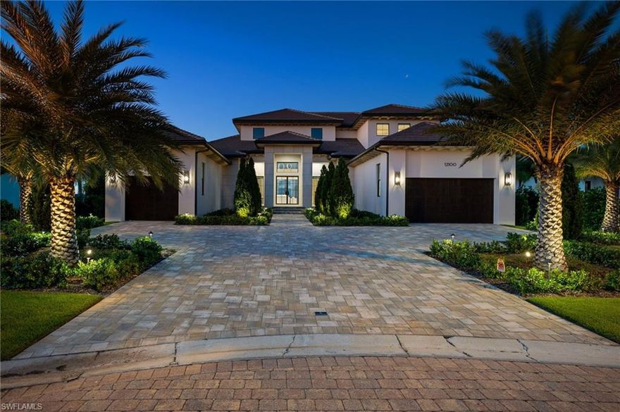 Experience the pinnacle of coastal luxury in this brand-new, turnkey furnished residence by renowned builder PGI Homes, perfectly situated within Trevi—an exclusive gated enclave of just seven custom waterfront estates.
Showcasing a refined blend of modern design and timeless detail, this 4-bedroom + den residence invites you in with a grand 20-foot entryway, soaring ceilings, and a wall of glass framing the tranquil water views beyond. The open-concept great room flows seamlessly into a gourmet kitchen outfitted with custom crystal cabinetry, Wolf and Sub-Zero appliances, and an oversized waterfall island ideal for entertaining. The first-floor VIP suite offers a peaceful retreat with a spa-like bath and private flex space—perfect for a home office or nursery. Upstairs, an elegant staircase and elevator lead to a spacious loft and covered terrace overlooking the water, providing an additional setting for relaxation or recreation. Outdoors, enjoy an expansive lanai with a negative-edge pool and spa, summer kitchen with grill and roll-down screens, and a deep-water dock ready for your boat. Thoughtfully designed landscaping and a three-car garage complete the picture of effortless elegance. Set on an oversized cul-de-sac lot, this home defines the Southwest Florida lifestyle—light, bright, and beautifully livable from every angle.