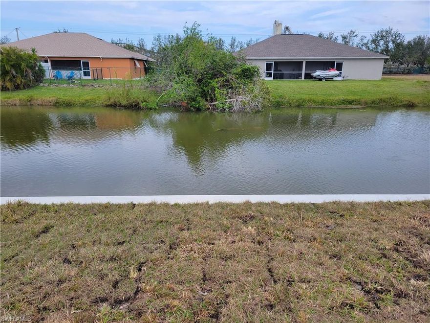 Oversized triple lot, canal front, vacant lot. New seawall. All assesments paid.