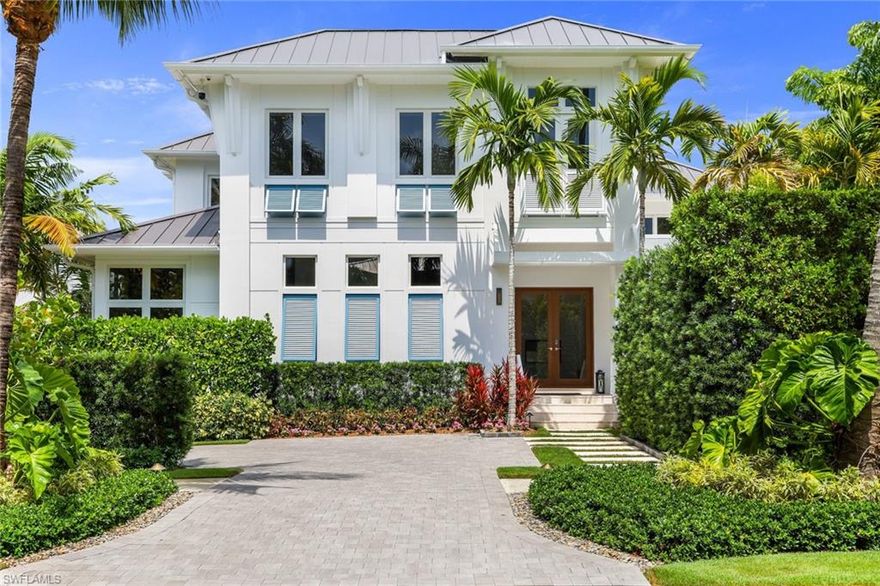 This magnificent move-in ready fully furnished MHK designed home balances a luxurious array of comforts & amenities with modern architecture that harkens back to the foundational architectural elements of classical Florida living. This comfortably elegant residence that is only 5 years young lives as grandly or as intimately as you please located only 1.5 blocks to our sugar sand beaches as well as a 2 block stroll to 5th Avenue South's acclaimed shopping & dining. Primary living areas are all on the first floor including the alluring Master Suite. 2nd floor has 4 additional ensuite bedrooms plus sunny Gathering Area & separate Study with vaulted shiplap ceilings. Outdoor living at its best! Lushly landscaped private west facing pool with water features & integrated spa, exceptional southern facing lanai area with amenities like 2-way gas fireplace, motorized rolldown screen, flat panel tv, Wolf gas grill, Sub Zero under counter fridge, serving counter & fully recessing sliding glass doors from main living areas. Full smart home state of the art automation Control-4 system & temperature controlled 400+ bottle Wine Room. To be sure a residence that will delight you. Come and enjoy!