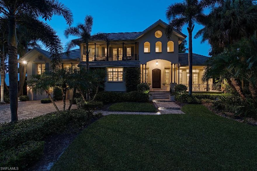 H.9620 Walk to the beach and 3rd Street South! Like-new, luxurious residence with extensive renovations just 3 homes from the beach! The main level features formal dining room, living room with fireplace, family room, chef’s kitchen, study and master retreat complete with wet bar and private veranda.   A two bedroom guest suite with private living/dining area and wet bar is located half a story up and two more guest bedrooms with private baths, home theater, loft /library and private balconies are located on the top floor.  The outdoor living space consists of gorgeous pool/spa, screened and open lanais and a private dock overlooking the lake.  Home is completed with soaring ceilings, top of the line finishes throughout, plentiful storage and over-sized 3 –car garage.  Complete list of improvements is in supplements.