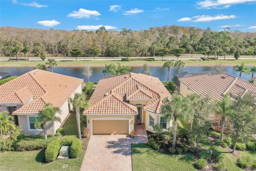 This 3 bed plus den Turnkey Vanderbilt model home is perfect for entertaining inside and out. The open concept floor plan captivates you with a breathtaking view of the pond and preserve from the moment you enter. The gourmet kitchen offers white shaker-style cabinets with quartz countertops and marble backsplash. High-end finishes can be found throughout, from the extended breakfast nook and laundry room cabinetry to contemporary light fixtures, fans and window treatments, tray ceilings, speakers, crown moldings, hardwood floors and transitional furnishings with clean lines in a neutral palette. Spacious outdoor living with 6 seat Hot Springs Waterfall Spa, a grill, sectional seating under the covered lanai all overlooking the lake. Outdoor built-in television recessed into a solid wall of quartz with floating shelves on stacked stone. The lanai ceiling is Cypress Pecky with built in speakers and fan. The private master retreat features dual sinks, walk-in shower, custom makeup vanity and a stunning California Closet. The home is located on a quiet cul-de-sac, a short walk from all club amenities and golf. Storm shutters and impact windows and doors make safety a priority.