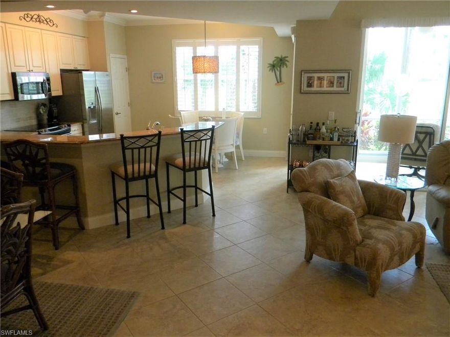 Beautifully Maintained 1st floor condo. This 2 BR + 2 BA "Carlisle" model features a spacious open floor plan, tray ceiling, and corner lanai. Offered Turnkey furnished, and move-in ready. Upgrades Galore. Granite counter tops throughout, plantation shutters on all windows. Large tile flooring in main living areas, and laminate floors in the bedrooms. Crown moldings, updated lighting and ceiling fans. Lanai has storm enclosures. Golf and tennis membership included. Acres of nature trails for jogging/bicycling. Amenities include community pools, clubhouse, restaurant, pub, and new poolside outdoor dining facility. A must see, with so much to offer.