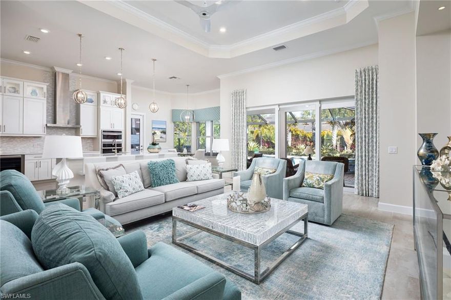 Welcome to this beautifully decorated 4 bedroom, 3 bath home, conveniently located closed to everything that Naples has to offer!  This hidden jewel is located on an oversized fenceable lot in Sereno Grove, a boutique community of only 64 homes off Livingston Road near Vanderbilt Beach Road. Enjoy the Florida paradise lifestyle in the private backyard with expansive pool deck, saltwater pool, lighted waterfall, spa and pool bath. Huge screened lanai with stunning outdoor kitchen with natural gas grille, and refrigerator.  Spacious floorplan allows privacy with the oversized great room and kitchen with a large island as a focal point and bedrooms on either side. Custom window treatments, 11’ 6”tray ceilings, beautiful 12 x 24 tile floors throughout, and impact glass windows and doors.  An abundance of interior closet space including 3 walk-ins, 2 additional large closets plus built in storage in the spacious 3 car garage.  A whole-house generator and new water softner treatment system have been added for additional convienence and comfort. Immediate Tiburon Medallion Membership is available (without the wait) that will enable you to enjoy, not only golf, but also the fabulous resort amenities including the Ritz Carlton pool, water park, outdoor dining and fitness center.