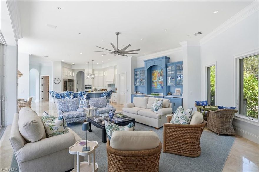 An extraordinary offering in the prestigious enclave of Collier’s Reserve—this is one of only six riverfront residences with direct Gulf access. Perfectly positioned along the water, this estate blends timeless elegance with extensive modern upgrades, creating a refined coastal retreat. The refreshed exterior features whole-house painting and new landscaping, enhancing curb appeal. Inside, the home has been thoughtfully reimagined with a redesigned staircase, updated LED lighting with Lutron controls, and a newly installed security system. Architectural details have been thoughtfully refined to enhance flow and create a more elevated, contemporary aesthetic. Offering four bedrooms, four full baths, a den, and a powder room, the residence balances comfort and sophistication. The primary suite features plush wool carpeting, custom window treatments, bespoke closets, and a fully renovated spa-inspired bath. Guest suites have been updated with new carpeting, designer wall coverings, custom cabinetry, and curated furnishings. The study showcases custom paint and Phillip Jeffries wall coverings. Entertaining spaces include a dining room with custom sisal rug and a fully renovated powder room. The kitchen has been expertly updated with custom-painted cabinetry, Sub-Zero wine column, illuminated glass cabinetry, updated backsplash, and bespoke pantry. The great room features a custom built-in with ice maker and sink. Additional highlights include a fully renovated laundry room with Electrolux appliances, custom cabinetry, added sink and counter space, and a spacious four-car garage. Offered furnished with designer-curated interiors for a turnkey experience. Enjoy serene riverfront living with direct Gulf access. Collier’s Reserve offers a championship golf course, tennis, pickleball, fitness center, dining, boating, kayaking, and scenic trails.