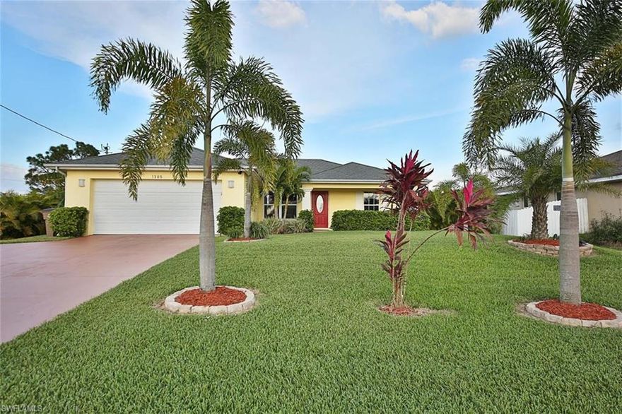 Immaculate 3 bedroom 2 bath gem is nestled in the desirable NE Cape Coral corridor. Home built in 2006 and has been maintained to a high standard by the current owner. Beautiful landscaping. Features include volume and vaulted ceilings, split bedroom plan with large bathrooms, laundry just off the kitchen, decorative ceiling fans, and an open floor plan with a center island. Newer stainless appliances and a Culligan Water System. Relax on the screened patio overlooking the large backyard and enjoy the sunshine and breezes. The yard is fenced so your dog has space to exercise and there is plenty of room for a pool. Home security system monitored by ADT. This home is sure to please your pickiest buyer or investor. Great starter home or perfect size for snowbirds.  Great neighborhood - close to all the shopping, entertainment and restaurants along the Pine Island Road corridor and just a short bridge drive to the downtown Ft Myers Historic River District. Great home or vacation rental! Look at the nearby comps and make an offer today.