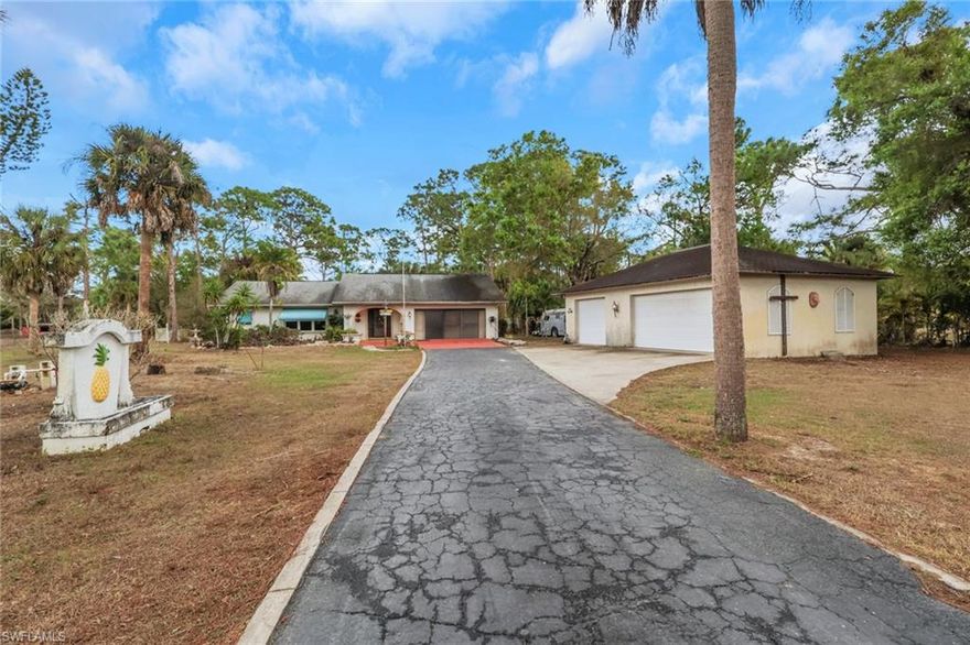 Located in unincorporated Lee County, this 3-bedroom, 2-bath home sits on 1.62 acres in North Fort Myers and offers the space and freedom that comes with acreage living. The property features a large private pool with a huge yard with plenty of room for outdoor activities, bon fires and animals. Store your trucks and trailers on your own property with no deed restrictions.  A major highlight is the 936 sq ft detached garage/workshop, providing excellent space for vehicles, tools, toys, or additional storage this is a detached garage. The size and flexibility of this building make it ideal for anyone needing extra workspace or room for toys and equipment. With over 2,000 sq ft of living area, the home offers comfortable living spaces. Large open kitchen with hardwood cabinets and solid surface counter tops. Large cover lanai over looks the pool area and is a great place to entertain family and friends. The lot provides privacy and plenty of room to enjoy the outdoors while still being conveniently located near shopping, dining, and major roadways. If you're looking for acreage, a pool, and a large detached garage in unincorporated Lee County, this property offers a great opportunity with plenty of potential.