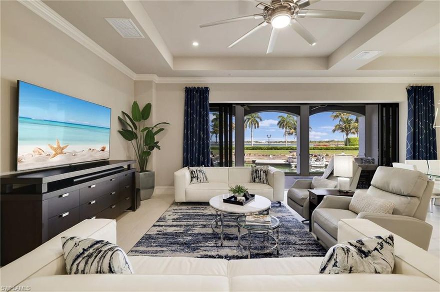 Enjoy a contemporary coastal lifestyle in this spacious end-unit condominium overlooking a quiet inlet of Miromar Lakes. Bright, airy interiors and an open-concept design create the perfect setting for effortless living and entertaining. The crisp white chef’s kitchen features sleek hardware, high-end appliances, and a breakfast bar, while retractable screens on the expansive lanai invite seamless indoor-outdoor living with peaceful water views and stunning Southwest Florida sunsets.

The spacious primary suite offers a walk-in closet and a spa-like bath with a deep soaking tub and separate glass-enclosed shower. With three bedrooms, three baths, manicured surroundings, and a coveted location in the luxury Ravenna neighborhood, this residence offers both comfort and style.

Miromar Lakes delivers a five-star resort lifestyle with freshwater lakes, white-sand beach, infinity pool, tennis, championship golf, two waterfront restaurants, a full-service wellness spa, and a vibrant social calendar year-round.