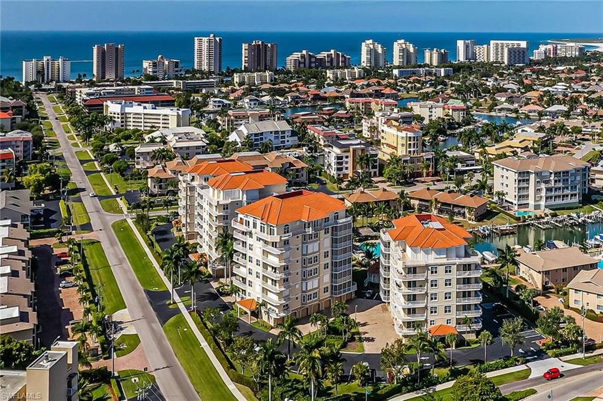 Bring your island attitude to this desirable condominium. Everything else is here and just needs your personal touch. When you enter the low-density building/complex & step into your private, lock-out elevator that opens to your personal foyer, you know you have found a treasure. When you enter this outstanding unit you are immediately drawn to the abundance of light from the generous windows/sliders that filters sunlight into the open & spacious living space. 3 bedrooms, each with their own private bath, & a half bath for common use is the perfect arrangement for any family or guest dynamic. When you move to the outdoor living space you take in spectacular views from both the screened lanai and open-air balcony of the island, pool, canal and Gulf of Mexico. Mornings are adorned with sparkling sunrises from the eastern exposure and both the southern & western views will give you breathtaking sunsets. Add to all these benefits – private garage, pool, tiki hut and clubhouse. Located at the desired quiet, south end, you are just a few blocks from the beach and Caxambas Park.