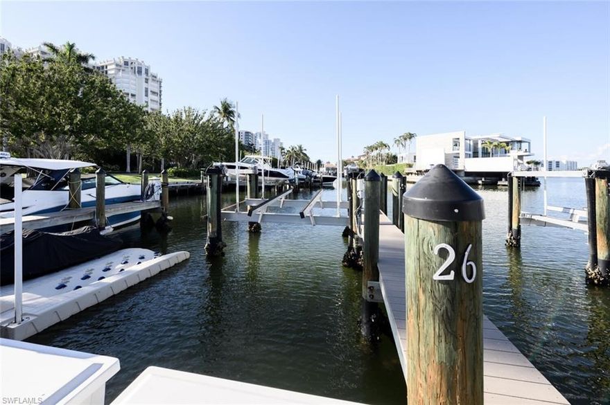 Just Listed this premium boat slip in the highly desirable Venetian Bay Yacht Club in Park Shore. Slip 26 at 4090 Gulf Shore Blvd N features a 16,000-lb lift, allowing you to keep your vessel safely out of the water while reducing maintenance and eliminating the need for bottom paint. This slip can accommodate vessels up to approximately 40 feet in length, offering convenient dockside access along with nearby parking for effortless loading and unloading before your day on the water.
Perfectly positioned in the heart of Park Shore, enjoy quick navigation through Venetian Bay to Doctor’s Pass and the Gulf of Mexico in just minutes. Located just south of Venetian Village, you can easily walk or bike to waterfront dining, shopping, and entertainment after returning from a day on the water. Exclusive to Park Shore residents, this is a rare chance to secure a protected slip with a lift, water and electric on site, in one of Naples’ most coveted boating locations.