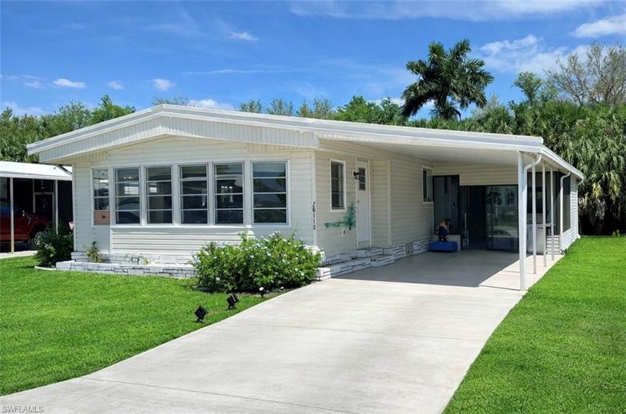 This 2-bedroom, 2-bath manufactured home is located in the desirable Imperial Harbor 55+ community and offers a comfortable layout with great storage and multiple living areas. The master bedroom includes an en suite bathroom. The hallway leading from the bedroom to the bathroom features two closets, one is a walk-in. The guest bathroom includes a built-in ledge accented with tile, providing convenient space for toiletries and cosmetics without crowding the vanity. The kitchen features a low breakfast bar and a pantry area, offering both storage and casual dining space. The dining room includes built-in cabinetry with glass doors, adding both charm and additional storage. There are two separate entrances to the home - one from the carport into the Florida room and another from the screened lanai directly into the kitchen area. Sliding glass doors from both the living room and dining room open into the Florida room, creating a seamless connection between living spaces. The Florida room is filled with natural light from multiple windows, making it a bright and inviting extension of the home.
Additional features include a carport, screened lanai, and a rear storage shed with a washer, dryer, and laundry tub. A separate rear door from the lanai provides access to the backyard, which backs up to a waterway, offering added privacy with no rear neighbors. This home includes a Harbor Club membership, providing access to the community’s heated pool, library, bocce ball, shuffleboard, billiards room, fitness area, and a variety of social activities. A wonderful place to call home in a vibrant 55+ community.